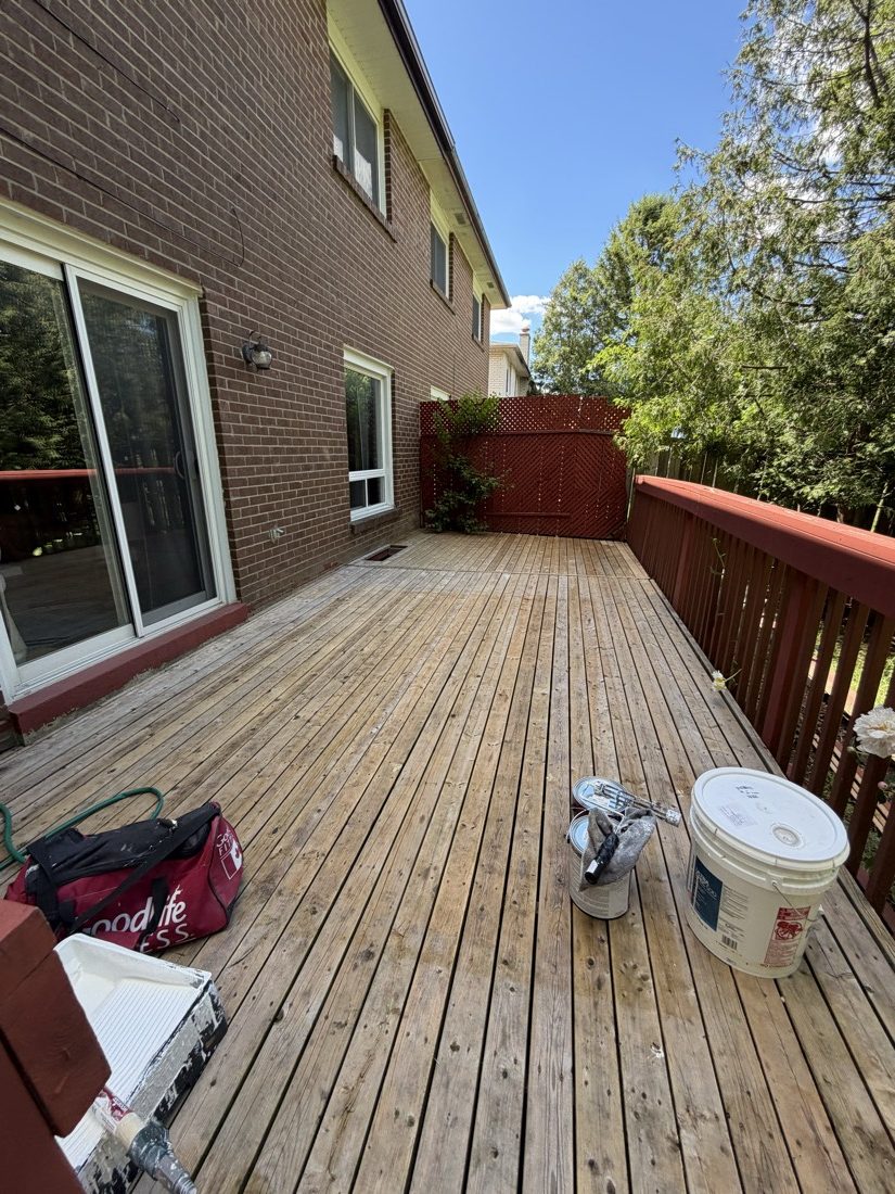 Bare, weathered backyard deck before staining by TrueCoat Painting in Brampton
