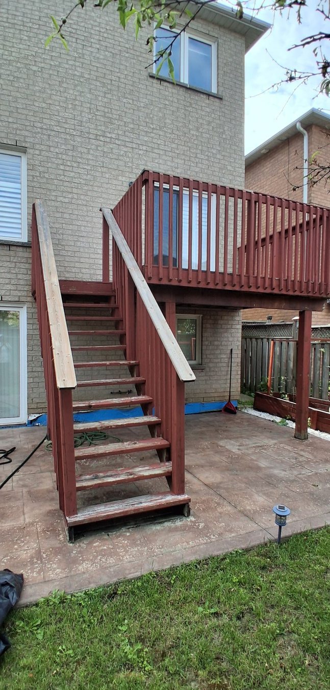 Weathered, faded deck staircase before staining by TrueCoat Painting