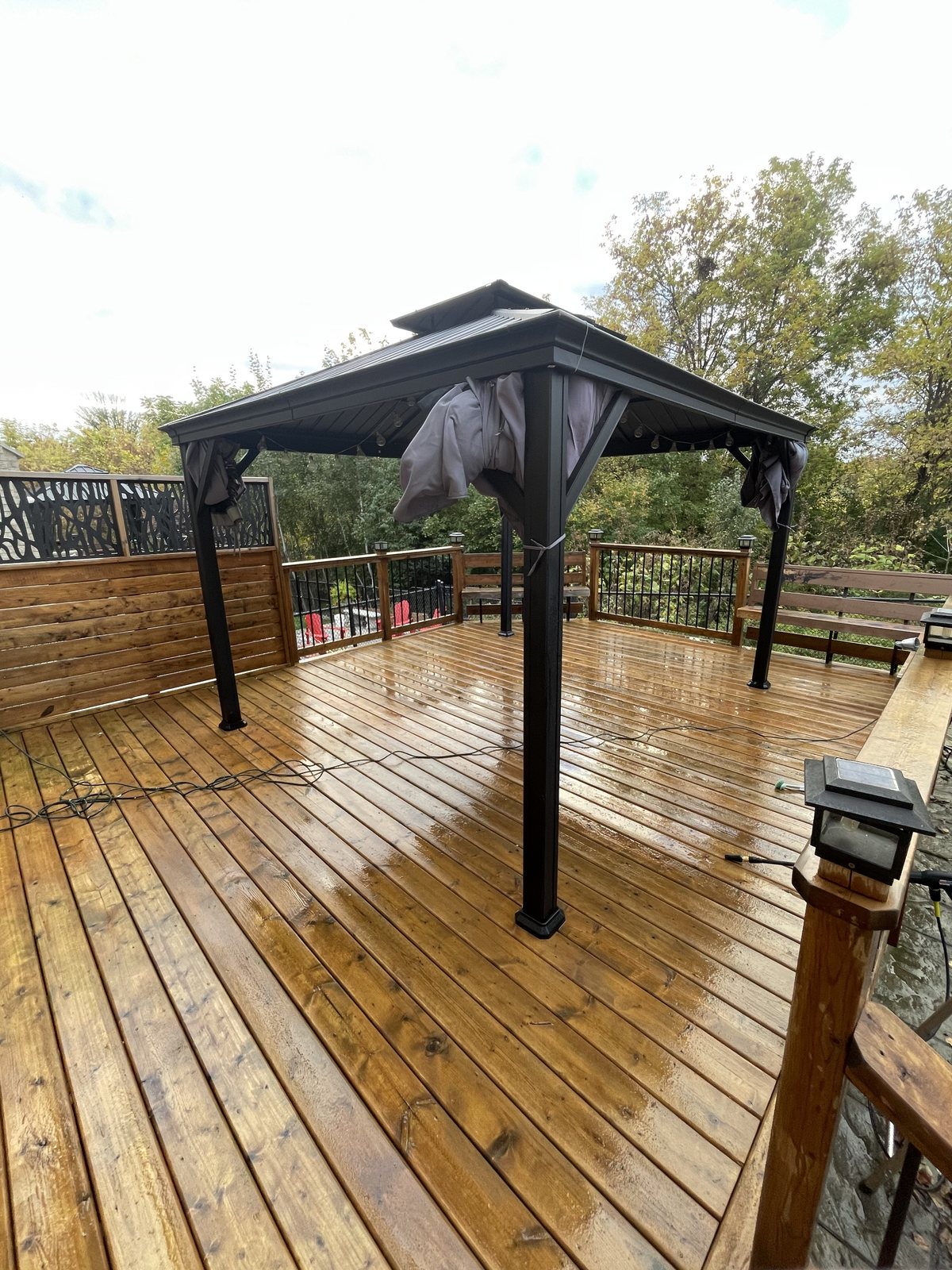 Freshly stained backyard deck with a gazebo, completed by TrueCoat Painting in Brampton